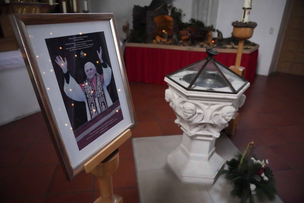 A picture of Pope emeritus Benedict XVI is placed besides a baptistery in the St. Oswald church in ...