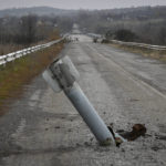 
              A tail of a multiple rocket sticks out of the ground near the recently recaptured village of Zakitne, Ukraine, Wednesday, Nov. 9, 2022.  This was the year war returned to Europe, and few facets of life were left untouched. Russia’s invasion of its neighbor Ukraine unleashed misery on millions of Ukrainians, shattered Europe’s sense of security, ripped up the geopolitical map and rocked the global economy. The shockwaves made life more expensive in homes across Europe, worsened a global migrant crisis and complicated the world’s response to climate change. (AP Photo/Andriy Andriyenko)
            