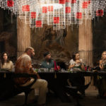 
              This image released by Netflix shows, from left, Edward Norton, Madelyn Cline, Kathryn Hahn, Dave Bautista, Leslie Odom Jr., Jessica Henwick, Kate Hudson, Janelle Monae, and Daniel Craig in a scene from "Glass Onion: A Knives Out Mystery." (Netflix via AP)
            
