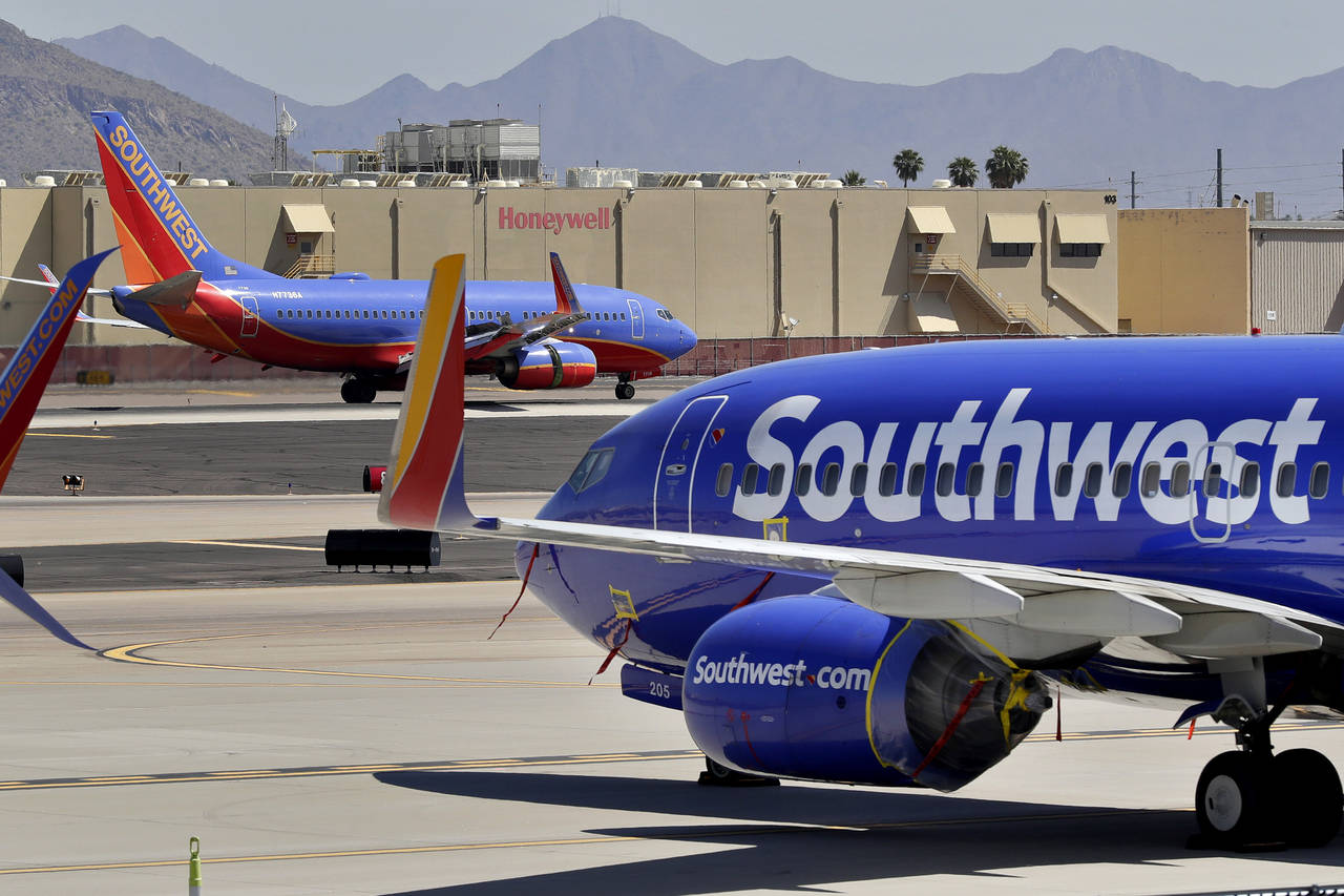 FILE - Southwest Airlines jets are stored at Sky Harbor International Airport in Phoenix, April 28,...