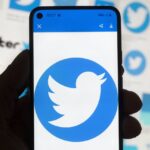 
              FILE - The Twitter logo is seen on a cell phone, Friday, Oct. 14, 2022, in Boston. (AP Photo/Michael Dwyer, File)
            