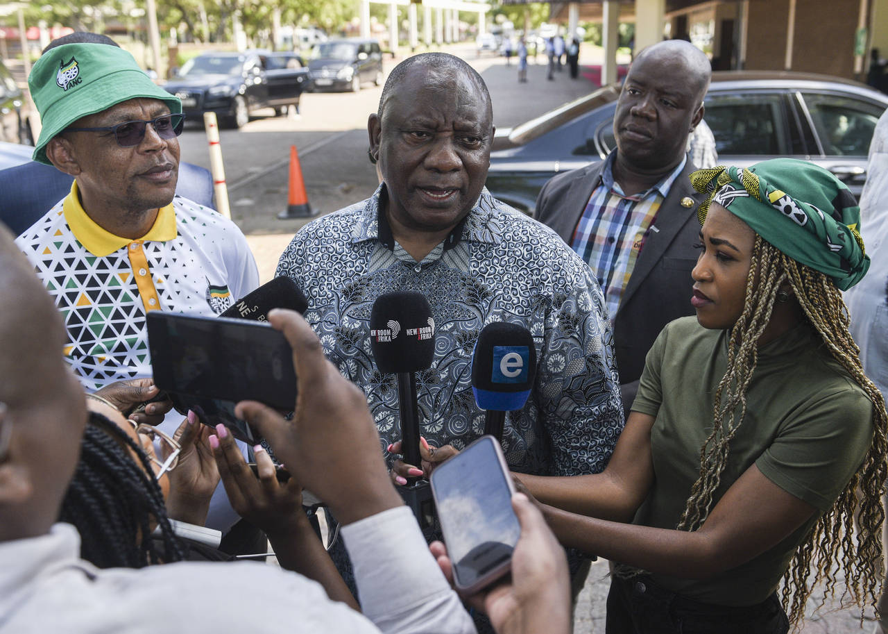 South African President Cyril Ramaphosa speaks to the media after leaving an African National Congr...