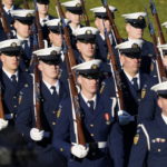 
              A ceremonial U.S. Coast Guard unit marches in before President Joe Biden welcomes French President Emmanuel Macron during a State Arrival Ceremony on the South Lawn of the White House in Washington, Thursday, Dec. 1, 2022. (AP Photo/Patrick Semansky)
            