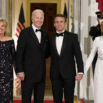 
              President Joe Biden and first lady Jill Biden greet French President Emmanuel Macron and his wife Brigitte Macron as they arrive for a State Dinner on the North Portico of the White House in Washington, Thursday, Dec. 1, 2022. (AP Photo/Patrick Semansky)
            