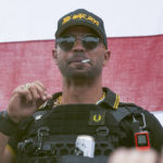 
              FILE - Proud Boys leader Henry "Enrique" Tarrio wears a hat that says The War Boys during a rally in Portland, Ore., on Sept. 26, 2020. Jury selection for the seditious conspiracy trial of former Proud Boys leader Enrique Tarrio and four lieutenants will resume in early January after a holiday break, according to court records. (AP Photo/Allison Dinner, File)
            