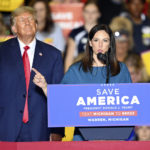 
              FILE - Former President Donald Trump, left, listens to Michigan Republican gubernatorial candidate Tudor Dixon, during a rally at the Macomb Community College Sports & Expo Center in Warren, Mich., Oct. 1, 2022. Dixon lost to Democrat incumbent Gov. Gretchen Whitmer. (Todd McInturf/Detroit News via AP, File)
            