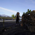 
              Illona Ilae, a Native Hawaiian from Kailua-Kona, Hawaii, sings as she leaves an offering in front an alter below the Mauna Loa volcano as it erupts Thursday, Dec. 1, 2022, near Hilo, Hawaii. Glowing lava from the world's largest volcano is a sight to behold, but for many Native Hawaiians, Mauna Loa's eruption is a time to pray, make offerings and honor both the natural and spiritual worlds. (AP Photo/Gregory Bull)
            