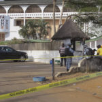 
              FILE - A road leading to the Etoile du Sud Hotel, seen in the background, is cordoned off near the site of an attack in Grand-Bassam, Ivory Coast, on March 15, 2016. Eleven people have been sentenced to life in prison in Ivory Coast on Wednesday Dec. 28, 2022 after being convicted of carrying out an Islamic extremist attack that killed 19 people and injured dozens more on a tourist beach nearly seven years ago. (AP Photo/Carley Petesch, File)
            
