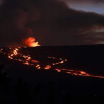 
              Lava glows at the Mauna Loa volcano Thursday, Dec. 1, 2022, near Hilo, Hawaii. (AP Photo/Gregory Bull)
            