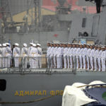 FILE - Sailors stand on deck on the Russian frigate Admiral Gorshkov as it prepares to dock at a port in Qingdao in eastern China's Shandong Province, Sunday, April 21, 2019. China says Chinese-Russian naval drills beginning Wednesday aim to "further deepen" cooperation between the sides whose unofficial anti-Western alliance has gained strength since Moscow's invasion of Ukraine. (AP Photo/Mark Schiefelbein, File)