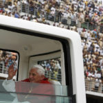 
              FILE - Pope Benedict XVI waves to faithful as he leaves after a special mass at the Amadou Ahidjo stadium, in Yaounde, Cameroon, March 19, 2009.Pope Emeritus Benedict XVI, the German theologian who will be remembered as the first pope in 600 years to resign, has died, the Vatican announced Saturday. He was 95. (AP Photo/Rebecca Blackwell, File)
            