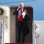 
              President Joe Biden returns a salute from the stairs of Air Force One at Andrews Air Force Base, Md., Friday, Dec. 2, 2022. (AP Photo/Luis M. Alvarez)
            