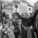 
              FILE - Joseph Ratzinger, the new archbishop of Munich and Freising, raises his arms to greet believers at his arrival in the Bavarian capital of Munich, Germany, on May 23, 1977. Pope Emeritus Benedict XVI, the German theologian who will be remembered as the first pope in 600 years to resign, has died, the Vatican announced Saturday. He was 95. (AP Photo/Dieter Endlicher, File)
            