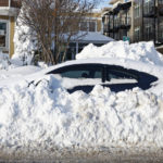 
              A car sits buried under snow, Wednesday, Dec. 28, 2022, in Buffalo N.Y., following a winter storm. (AP Photo/Jeffrey T. Barnes)
            