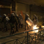 
              Riot police secure the area during a protest rally following the death of a teenager, in Athens, on Tuesday, Dec. 13, 2022. Thousands of protesters marched through the northern Greek city of Thessaloniki and Athens Tuesday night, as Roma community leaders appealed for calm after the death of a teenager shot in the head last week during a police chase over an allegedly unpaid gas station bill. (AP Photo/Yorgos Karahalis)
            