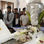 
              Relatives grieve during the funeral of Jose Yucra, 20, who was killed during protests against new President Dina Boluarte, in Ayacucho, Peru, Sunday, Dec. 18, 2022. The eight deaths this week that converted Ayacucho into the epicenter of violence in Peru's still unfolding crisis is for many a stark reminder of the region's bloody past and longstanding neglect by authorities in the far-away capital. (AP Photo/Hugo Curotto)
            