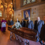 
              The coffin of Cardinal George Pell arrives to lay in state at St. Mary's Cathedral in Sydney, Wednesday, Feb. 1, 2023. Pell, who was once the third-highest ranking cleric in the Vatican and spent more than a year in prison before his child abuse convictions were overturned in 2020, died in Rome on Jan. 10 at age 81. (Giovanni Portelli/Archdiocese of Sydney, Pool Photo via AP)
            