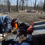 
              Leighea Johnson points to where her mobile home was located before a tornado that ripped through Central Alabama earlier this week destroying her home on Saturday, Jan. 14, 2023 in Marbury, Ala. Her daughter and grandson where in the home and survived with minor injuries. (AP Photo/Butch Dill)
            