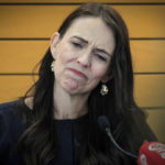 
              New Zealand Prime Minister Jacinda Ardern grimaces as she announces her resignation at a press conference in Napier, New Zealand Thursday, Jan. 19, 2023. Ardern says that she will not contest this year's general elections. (Warren Buckland/New Zealand Herald via AP)
            