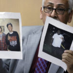
              Jesse De La Cruz, a former gang member who was imprisoned for 30 years before earning his doctorate and becoming a gang expert, holds photos of Drake and Wiz Khalifa, left, and Robert Allen a former co-defendant in the case, while testifying during a hearing in the XXXTentacion murder trial at the Broward County Courthouse in Fort Lauderdale, Fla., Wednesday, Jan. 18, 2023. Michael Boatwright, 28, and his alleged accomplices, Dedrick Williams, 26, and Trayvon Newsome, 24, are on trial for the June 2018 shooting of emerging rap star XXXTentacion, whose real name was Jahseh Onfroy. They also are charged with armed robbery and have pleaded not guilty. (Amy Beth Bennett/South Florida Sun-Sentinel via AP, Pool)
            