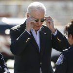 
              President Joe Biden removes his sunglasses as he tours El Paso port of entry, Bridge of the Americas, a busy port of entry along the U.S.-Mexico border, in El Paso Texas, Sunday, Jan. 8, 2023. (AP Photo/Andrew Harnik)
            