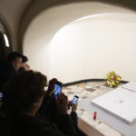 
              Faithful visit the tomb of late Pope Emeritus Benedict XVI inside the grottos of St. Peter's Basilica, at the Vatican, Sunday, Jan. 8, 2023. Benedict died at 95 on Dec. 31 in the monastery on the Vatican grounds where he had spent nearly all of his decade in retirement, his days mainly devoted to prayer and reflection. (AP Photo/Gregorio Borgia)
            