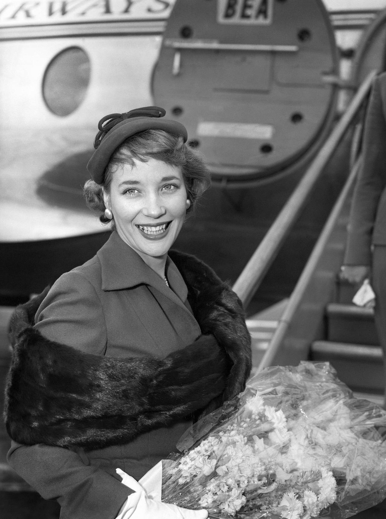 In this file photo dated July 1, 1957, Sylvia Syms prepares to leave London Airport for Berlin to a...