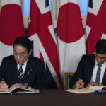 
              Britain's Prime Minister Rishi Sunak, right, and Japan's Prime Minister Fumio Kishida sign a defence agreement during a bilateral meeting at the Tower of London, Wednesday, Jan. 11, 2023. The leaders of Britain and Japan are signing a defense agreement on Wednesday that could see troops deployed to each others’ countries. (Carl Court/Pool Photo via AP, File)
            
