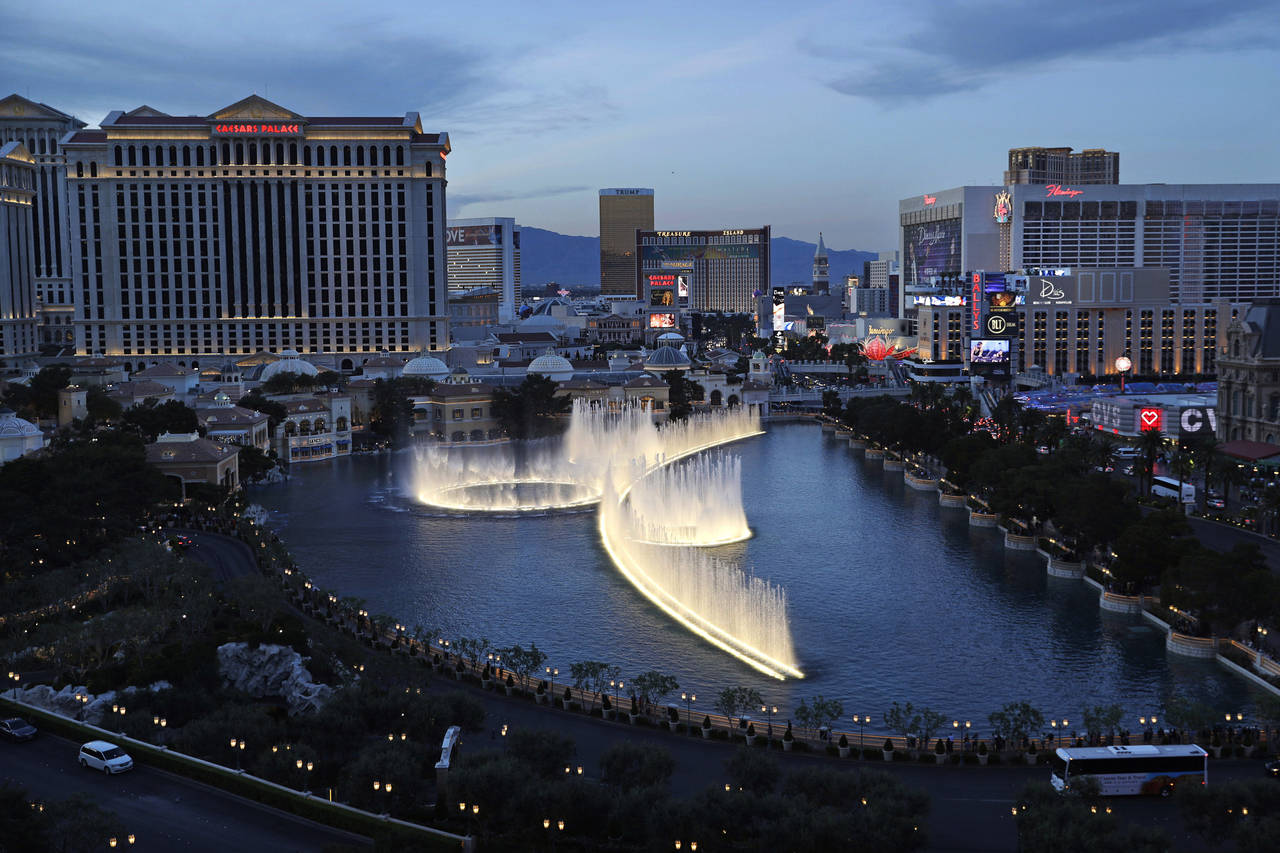FILE - In this April 4, 2017, file photo, fountains erupt along the Las Vegas Strip in Las Vegas. A...