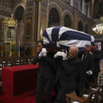 
              The coffin of former king of Greece Constantine II arrive for his funeral at Metropolitan Cathedral in Athens, Monday, Jan. 16, 2023. Constantine died in a hospital late Tuesday at the age of 82 as Greece's monarchy was definitively abolished in a referendum in December 1974. (Stoyan Nenov/Pool via AP)
            