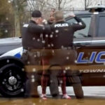 
              CORRECTS THE SPELLING TO LATICKA HANCOCK FROM LATINKA This screen grab made from video shows Butler Township officers Sgt. Tim Zellers, left, and Todd Stanley, right, restrain and arrest Laticka Hancock outside a McDonald's restaurant in Butler Township, Ohio, on Monday, Jan. 16, 2023. The officers said Hancock resisted arrest, and video shows Stanley strike Hancock. (Mario Robinson/ LOCAL NEWS X /TMX via AP)
            