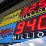 
              A sign displays the estimated jackpots for the Mega Million and Powerball lotteries di at Dot's Dollar More or Less shop in Mt. Lebanon, Pa., Thursday, Jan. 5, 2022. Twenty-three consecutive drawings later with no grand prize winner named, the Mega Millions jackpot is now flirting with nearly $1 billion, making it one of the largest jackpots in lottery history. (AP Photo/Gene J. Puskar)
            