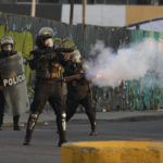 
              Police launch tear gas to disperse demonstrators during one of the daily protests demanding the resignation of Peruvian President Dina Boluarte, in Lima, Peru, Thursday, Jan. 26, 2023. Protesters are seeking immediate elections, President Dina Boluarte's resignation, the release of President Pedro Castillo, ousted and arrested for trying to dissolve Congress in December, and justice for protesters killed in clashes with police. (AP Photo/Martin Mejia)
            