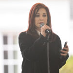 
              Priscilla Presley reads a poem written by granddaughter Harper Lockwood during a memorial service for her daughter Lisa Marie Presley at Graceland Sunday, Jan. 22, 2023, in Memphis, Tenn. Lisa Marie died Jan. 12 after being hospitalized for a medical emergency and was buried on the property next to her son Benjamin Keough, and near her father Elvis Presley and his two parents. (AP Photo/John Amis)
            
