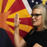 
              The new Arizona Democratic Gov. Katie Hobbs takes the oath of office in a ceremony at the state Capitol in Phoenix, Monday, Jan. 2, 2023. (AP Photo/Ross D. Franklin, Pool)
            