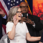 
              Arizona Democratic Gov. Katie Hobbs takes the ceremonial oath of office during a public inauguration at the state Capitol in Phoenix, Thursday, Jan. 5, 2023. (AP Photo/Ross D. Franklin)
            