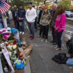 
              FILE - A group pauses, with some in prayer, at a makeshift memorial on a New York City bike path, on Nov. 4, 2017, that that honors victims of an attack who were stuck and killed by a rental truck driven by indicted suspect Sayfullo Saipov. Saipov, an Islamic extremist who killed eight in a New York bike path attack was convicted of federal crimes on Thursday, Jan. 26, 2023, and could face the death penalty. (AP Photo/Craig Ruttle)
            