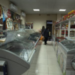
              Customers visit an almost empty food store in Stepanakert, the capital of the separatist region of Nagorno-Karabakh, also known as Artsakh, on Saturday, Jan. 7, 2023. Protesters claiming to be ecological activists have blocked the only road leading from Armenia to Nagorno-Karabakh for more than a month, leading to increasing food shortages. Local authorities have called for a humanitarian airlift for critical supplies, but Azerbaijan has not authorized the region's airport to operate. (Edgar Harutyunyan/PAN Photo via AP)
            
