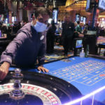
              A dealer conducts a game of roulette at the Ocean Casino Resort in Atlantic City, N.J. on Dec. 2, 2022. Figures released by New Jersey gambling regulators on Tuesday, Jan. 17, 2023, show Atlantic City casinos casinos matched their all-time high of $5.2 billion in total gambling revenue in 2022, although only half of that was won from in-person gamblers physically present at casinos. (AP Photo/Wayne Parry)
            