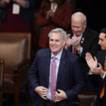 
              Rep. Kevin McCarthy, R-Calif., stands as he is nominated for a twelfth time in the House chamber as the House meets for the fourth day to elect a speaker and convene the 118th Congress in Washington, Friday, Jan. 6, 2023. (AP Photo/Alex Brandon)
            