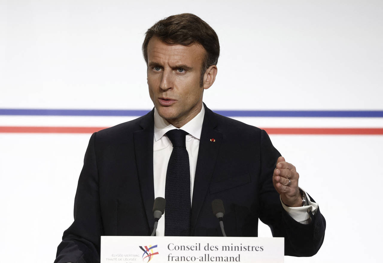 French President Emmanuel Macron attends a joint press conference with German Chancellor Olaf Schol...