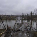 
              A destroyed bridge across Siverskyi-Donets river is seen in the village of Bogorodychne, Ukraine, Friday, Jan. 6, 2023. (AP Photo/Evgeniy Maloletka)
            