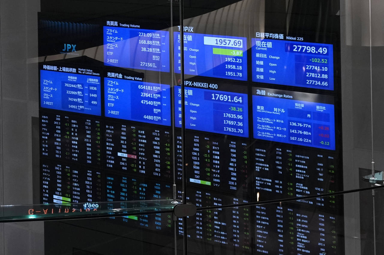 Stock prices are seen on board at the Tokyo Stock Exchange on Dec. 12, 2022, in Tokyo, Japan. Asian...