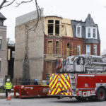 
              The Chicago Fire Department cordons off the area during search and rescue after a building collapse in Chicago’s Bronzeville neighborhood, Thursday, Jan 12, 2023. (Anthony Vazquez/Chicago Sun-Times via AP)
            