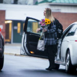 
              A woman carries flowers outside Richneck Elementary School in Newport News, Va., on Monday, Jan. 30, 2023. The Virginia elementary school where a 6-year-old boy shot his teacher has reopened with stepped-up security and a new administrator.(AP Photo/John C. Clark)
            