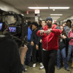 
              In this image provided by the Des Moines Public Schools, community activist and rap artist Will Keeps records a music video with students in a hallway at Des Moines Public School's Central Campus, on Jan. 29, 2016, in Des Moines, Iowa. Keeps is hospitalized in serious condition after surgery following just the sort of violence he's devoted his life to stop -- a shooting that killed two teenagers at the Starts Right Here educational program he founded in Des Moines. Keeps was hurt Monday, Jan. 23, 2023, when he tried to intervene. (Jon Lemons/Des Moines Public Schools via AP)
            