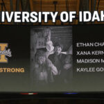 
              FILE - A photo and the names of four University of Idaho students who were killed over the weekend at a residence near campus are displayed during a moment of silence, Nov. 16, 2022, before an NCAA college basketball game in Moscow, Idaho. Nearly two months after four University of Idaho students were killed near campus — and two weeks after a suspect was arrested and charged with the crime — the picturesque school grounds are starting to feel a little closer to normal. (AP Photo/Ted S. Warren, File)
            
