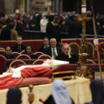 
              The body of late Pope Emeritus Benedict XVI is lied out in state inside St. Peter's Basilica at The Vatican, Wednesday, Jan. 4, 2023. Pope Benedict, the German theologian who will be remembered as the first pope in 600 years to resign, has died, the Vatican announced Saturday, Dec. 31, 2022. He was 95.(AP Photo/Ben Curtis)
            