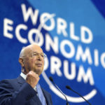 
              FILE - Klaus Schwab, President and founder of the World Economic Forum, delivers his opening speech of the forum in Davos, Switzerland, May 23, 2022.  (AP Photo/Markus Schreiber, file)
            