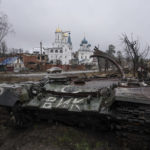 
              A destroyed Russian tank stands across the road of a church in the town of Sviatohirsk, Ukraine, Friday, Jan. 6, 2023. (AP Photo/Evgeniy Maloletka)
            